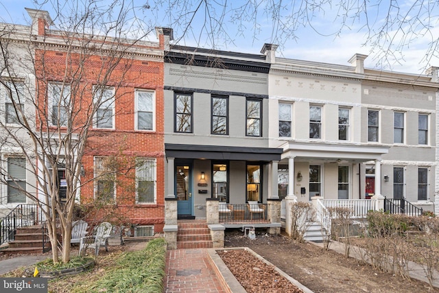 view of property with a porch