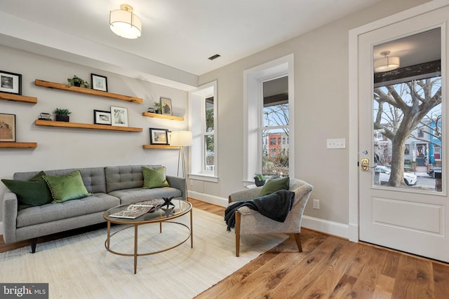 living room with light hardwood / wood-style floors