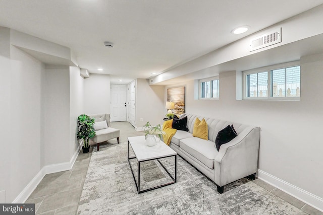 living room with tile patterned flooring