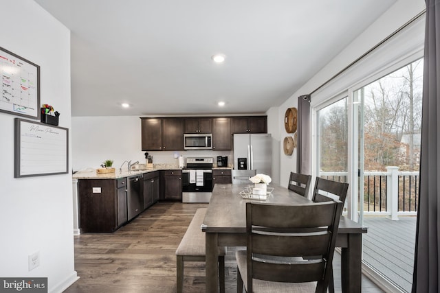 dining room with dark wood-type flooring and sink