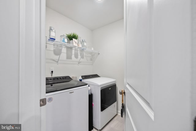 laundry area featuring independent washer and dryer