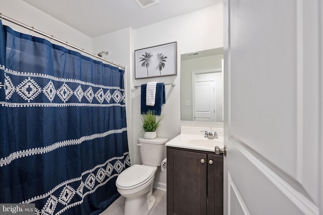 bathroom with vanity, toilet, and a shower with shower curtain