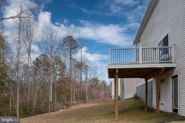 view of yard with a balcony