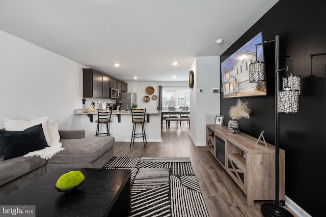 living room featuring dark hardwood / wood-style floors