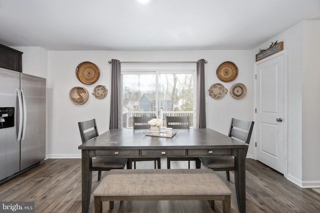 dining room with dark hardwood / wood-style floors