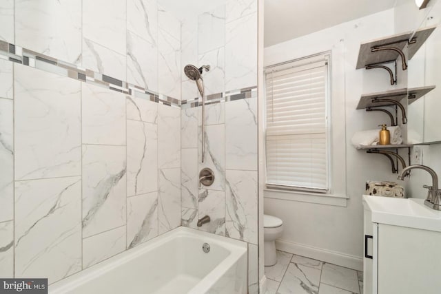 full bathroom featuring tiled shower / bath combo, sink, and toilet