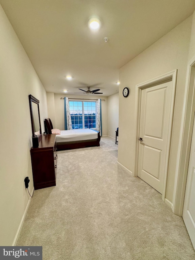 carpeted bedroom with ceiling fan