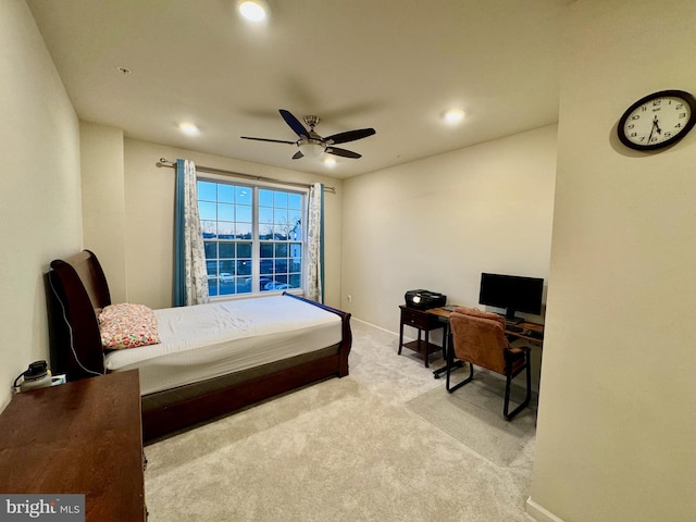 bedroom featuring light carpet and ceiling fan