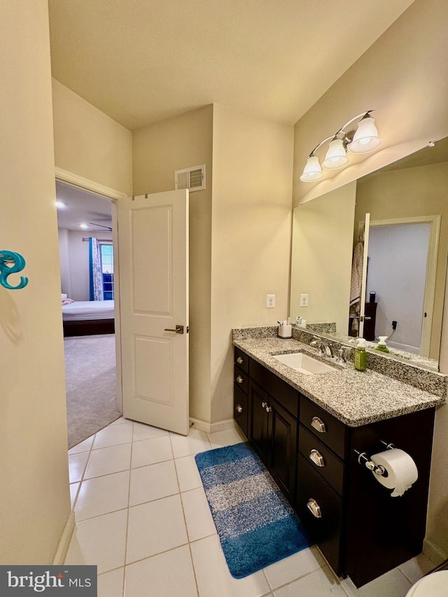 bathroom with vanity and tile patterned floors