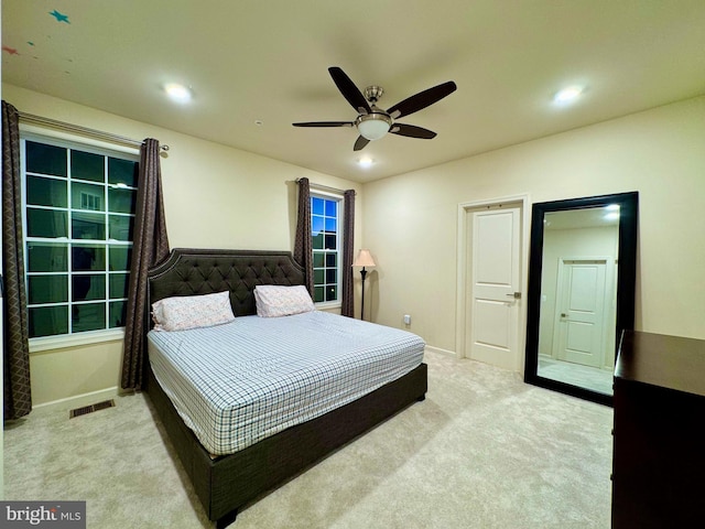 carpeted bedroom featuring ceiling fan