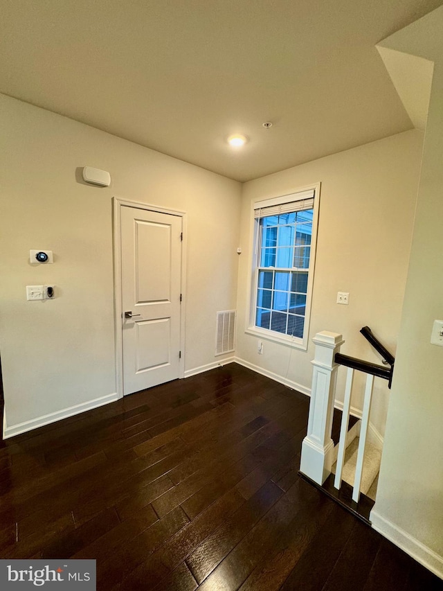 empty room featuring dark hardwood / wood-style floors