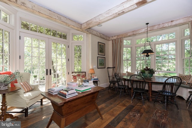 sunroom with beam ceiling, french doors, and a healthy amount of sunlight