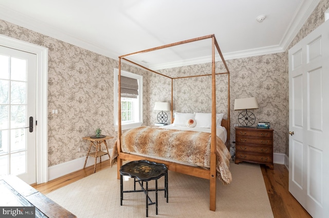 bedroom featuring light hardwood / wood-style flooring and ornamental molding