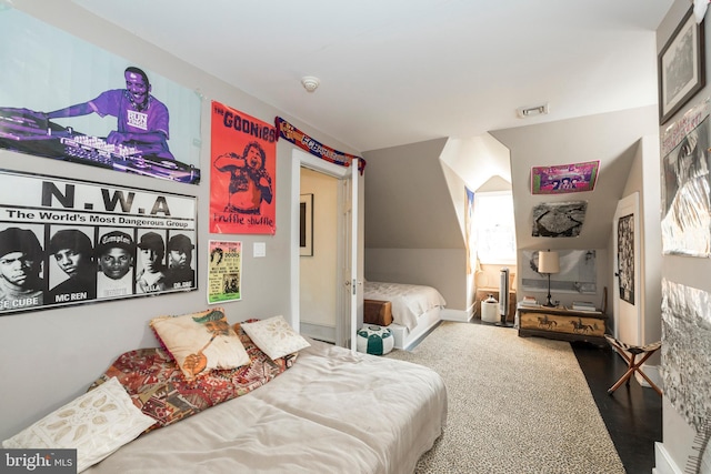 bedroom featuring wood-type flooring