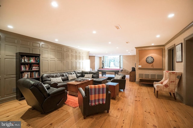 living room featuring crown molding, pool table, and light hardwood / wood-style flooring