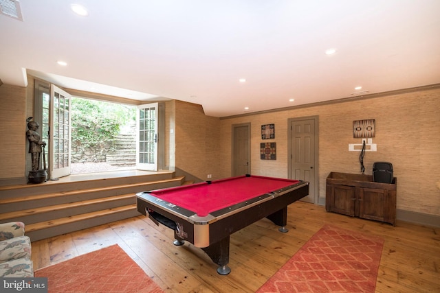 playroom with pool table, wood-type flooring, and ornamental molding