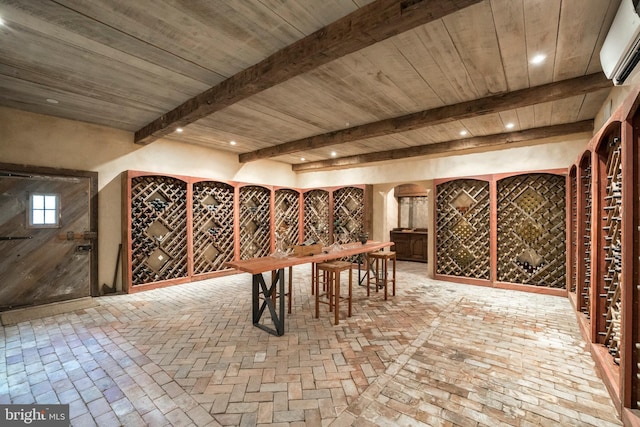 wine cellar featuring beam ceiling, a wall unit AC, and wood ceiling