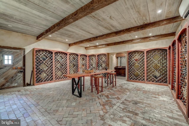 wine room featuring beam ceiling and wood ceiling