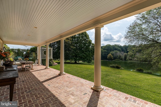 view of patio / terrace with a water view