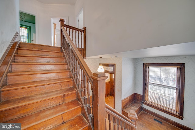 stairway featuring wood-type flooring