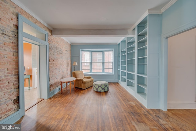 unfurnished room with hardwood / wood-style flooring and ornamental molding