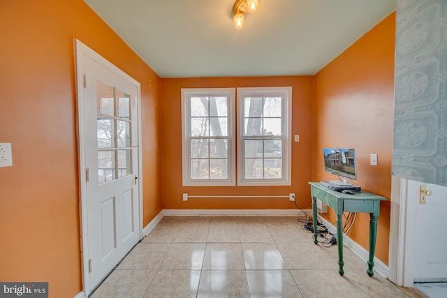 doorway featuring light tile patterned floors