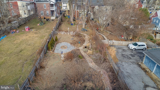 birds eye view of property with a residential view