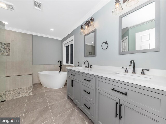 bathroom with tile patterned floors, crown molding, tile walls, vanity, and independent shower and bath