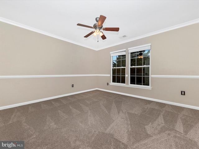 spare room featuring ornamental molding, ceiling fan, and carpet flooring