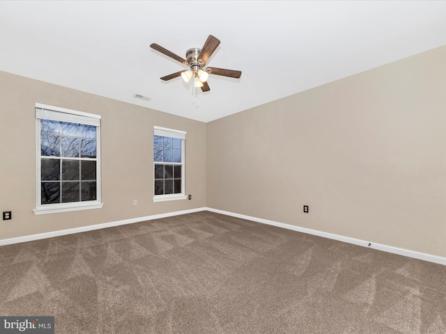 empty room featuring ceiling fan and carpet flooring