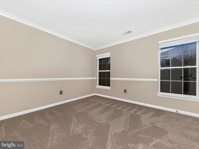 carpeted spare room with crown molding