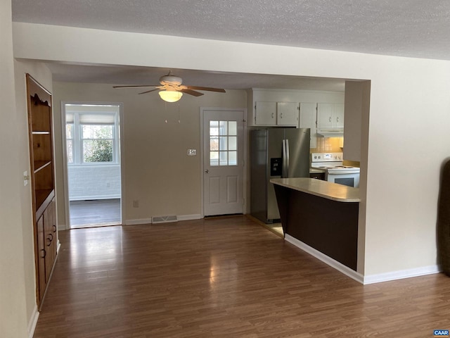 kitchen with stainless steel fridge with ice dispenser, white cabinets, dark hardwood / wood-style flooring, and white range with electric cooktop