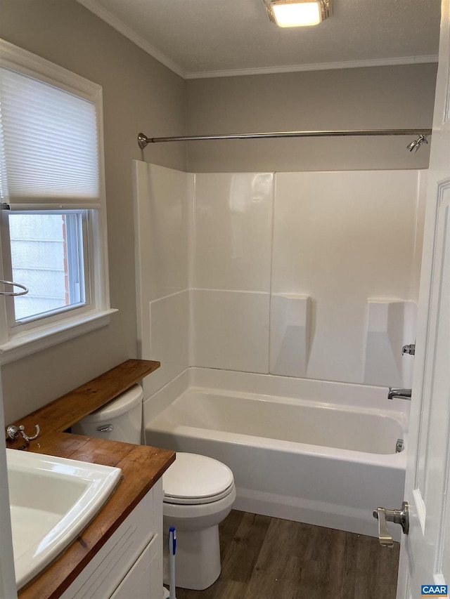 full bathroom featuring vanity, hardwood / wood-style floors, shower / washtub combination, and toilet