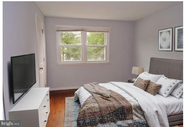 bedroom featuring dark wood-type flooring