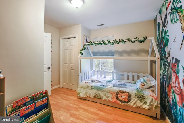 bedroom with hardwood / wood-style floors