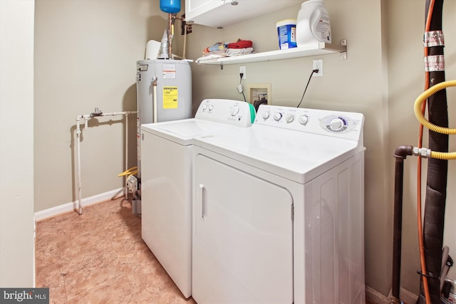 washroom featuring washer and clothes dryer and water heater