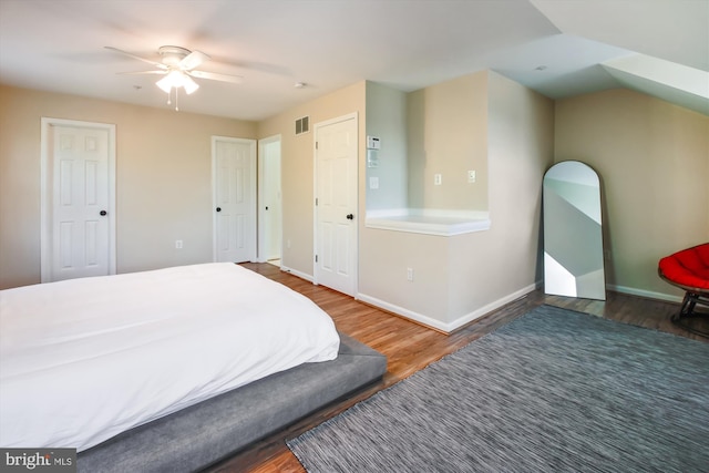 bedroom featuring ceiling fan and dark hardwood / wood-style floors