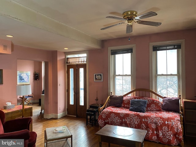 bedroom with hardwood / wood-style floors and ceiling fan