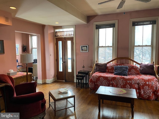 living room featuring hardwood / wood-style floors, ceiling fan, and french doors