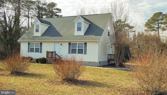 cape cod house featuring a front lawn, crawl space, and a shingled roof