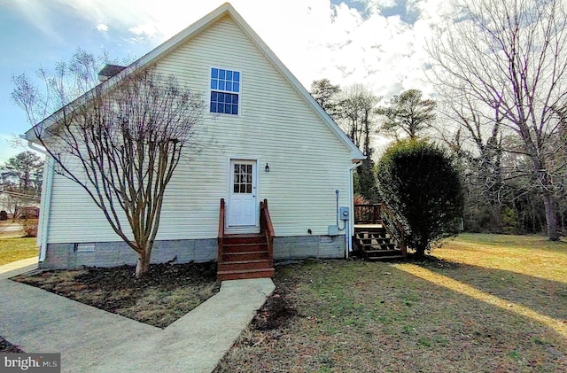 back of house featuring entry steps and crawl space