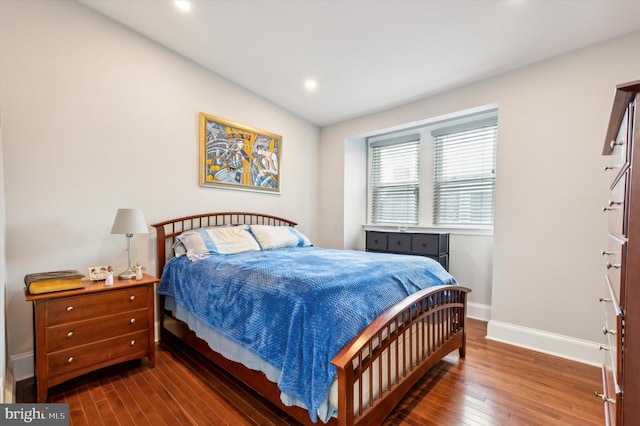 bedroom featuring dark wood-type flooring