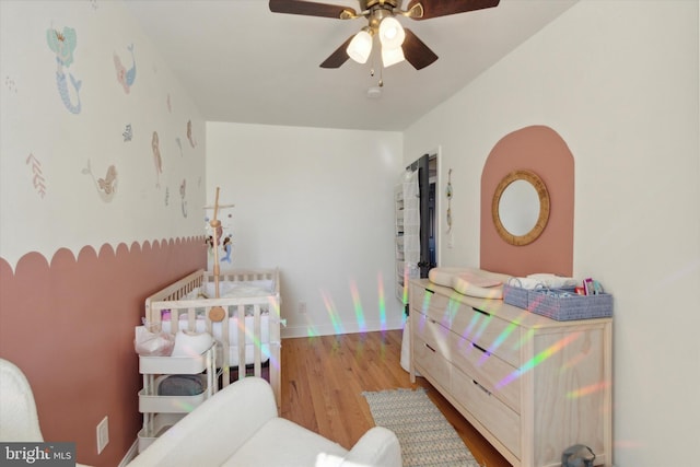 bedroom featuring ceiling fan and light hardwood / wood-style flooring