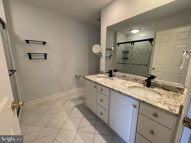 bathroom with walk in shower and vanity