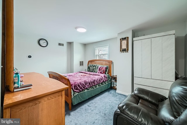 bedroom featuring light colored carpet