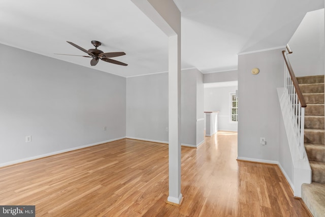 unfurnished living room featuring crown molding, light hardwood / wood-style floors, and ceiling fan