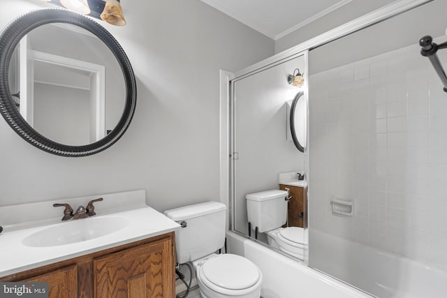 full bathroom featuring enclosed tub / shower combo, vanity, crown molding, and toilet