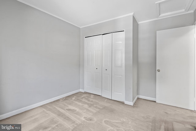 unfurnished bedroom with a closet, ornamental molding, and light carpet