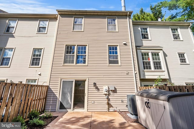 back of house featuring cooling unit and a patio