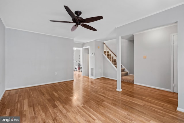 unfurnished living room with wood-type flooring, ceiling fan, and crown molding